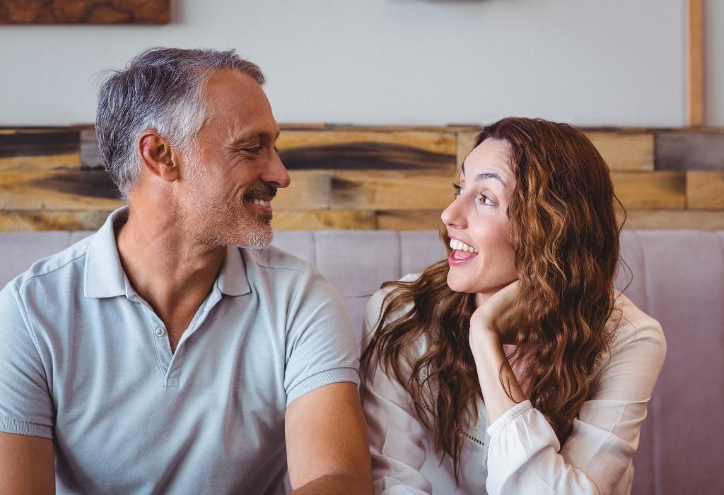 a couple in their 50s reviewing health insurance